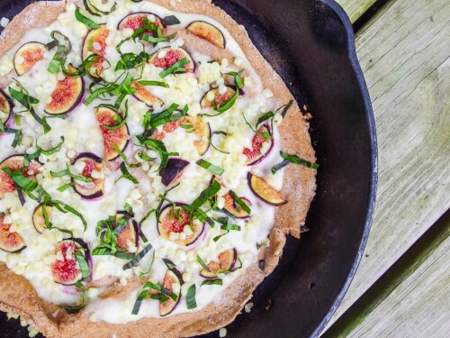 Amaranth Flatbread with Figs, Sweet Corn, and Shallot Cashew Cream Sauce cooked in a skillet