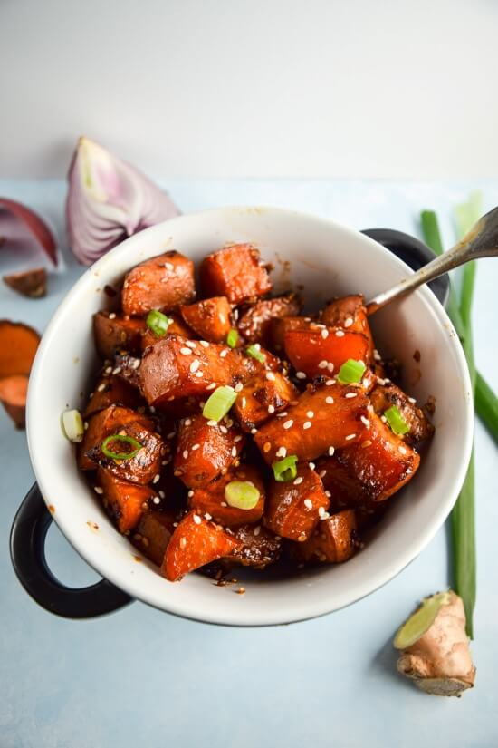 Asian inspired sticky teriyaki sweet potatoes with fresh, bright sliced green onions hit the perfect balance between savory and sweet