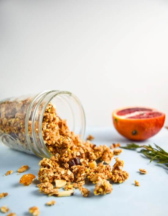 A jar of healthy sweet, savory, and crunchy maple tahini millet granola with natural sugars from dried fruits and filling fats from nuts