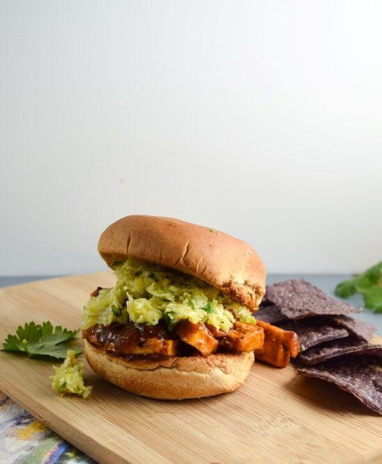 BBQ Tofu Sandwiches with from scratch sauce and fresh vegetable slaw on a soft hamburger bun | yupitsvegan.com. Recipe for hearty vegan BBQ tofu sandwiches, adapted from Cook the Pantry by Robin Robertson.