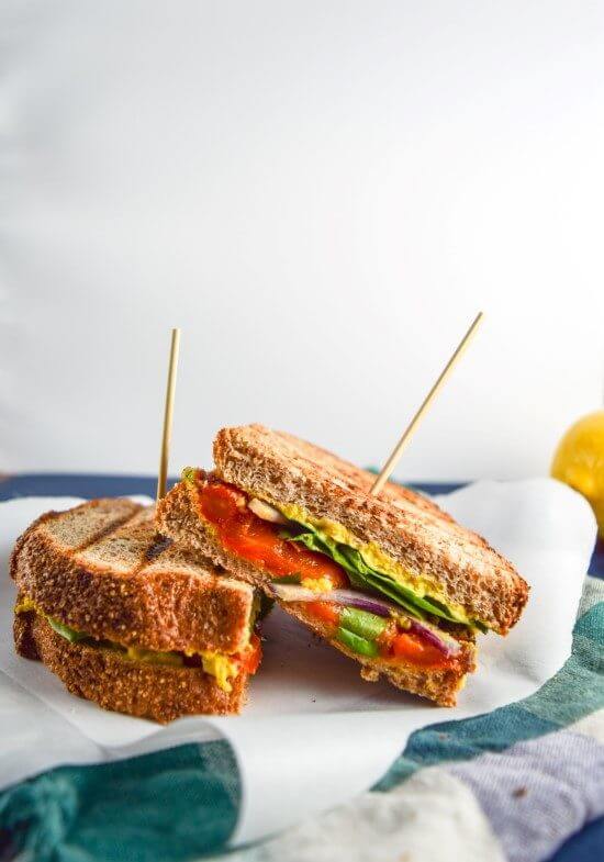 Mango Curry Hummus and Tandoori Roasted Red Pepper Panini | yupitsvegan.com. Mouthwatering, hearty, brightly-flavored vegan sandwiches made with sweet and tangy mango curry hummus and spicy tandoori-spiced roasted red peppers.