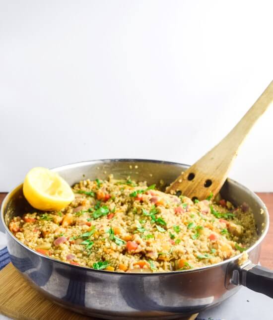 One Pot Moroccan Quinoa with Red Lentils | yupitsvegan.com. Hearty quinoa dish that all cooks in one pan, packed with veggies, flavored with warming Moroccan spices, and finished with herbs, toasted almonds, and a splash of fresh citrus.