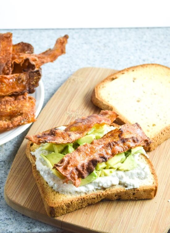 Openface sandwich made on gluten free bread with from scratch simply rice paper bacon, paired with rich avocado, and creamy mayo for the perfect lunch