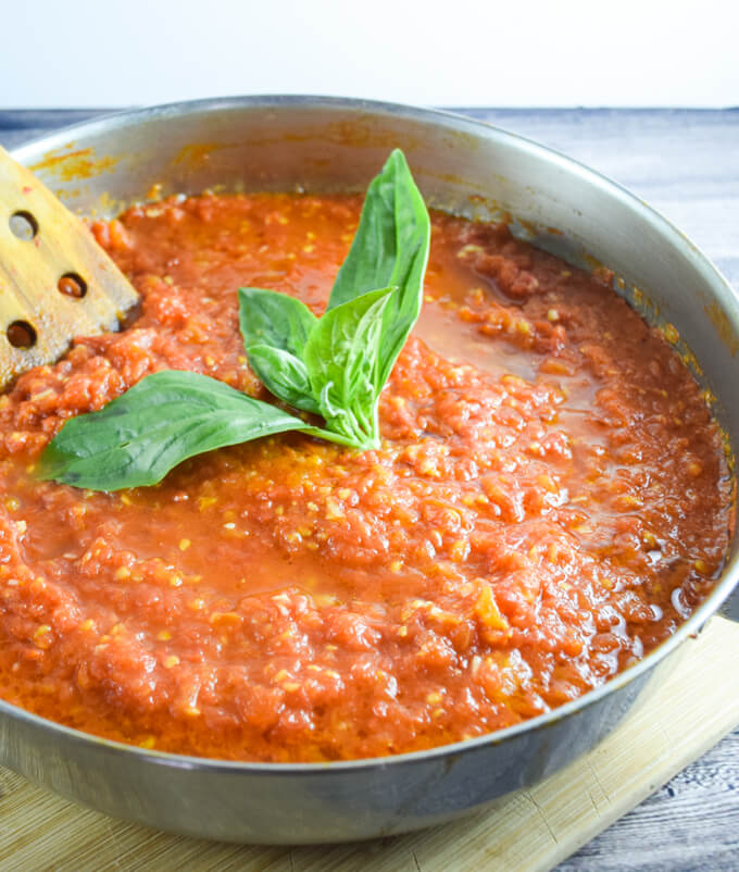 Close up of sweet, tangy, and robust 30-Minute Fresh Tomato Marinara Sauce with fresh herbs | Yup, it's Vegan