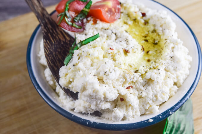 Closeup of creamy gluten and grain free, paleo, vegan ricotta cheese perfect for pizza or lasagna, or as a dip or spread