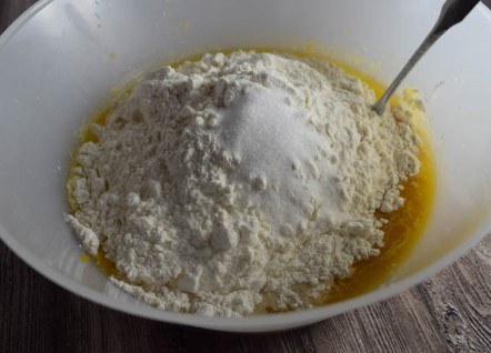Pumpkin Garlic Knots (Step-by-Step Pictures) | yupitsvegan.com - adding and stirring the flour