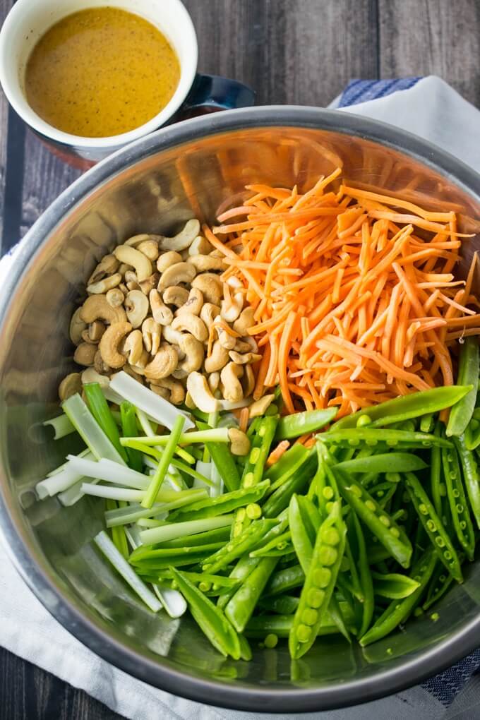 Cashew Sesame Snap Pea Salad | Yup, it's Vegan. Simple 7-ingredient, 15-minute salad with crunchy spring vegetables and orange sesame vinaigrette.