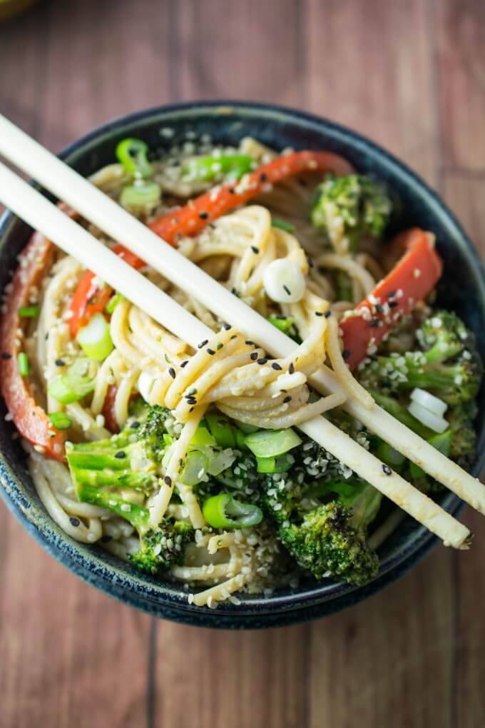 Sriracha Hemp Noodles | Yup, it's Vegan. Rice noodles tossed with a nutty garlic ginger sauce and served with broccoli and red peppers.