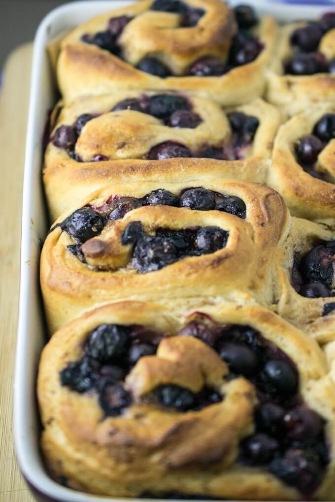 Vegan Blueberry Sweet Rolls, freshly baked to a golden brown and cooling in the baking dish.