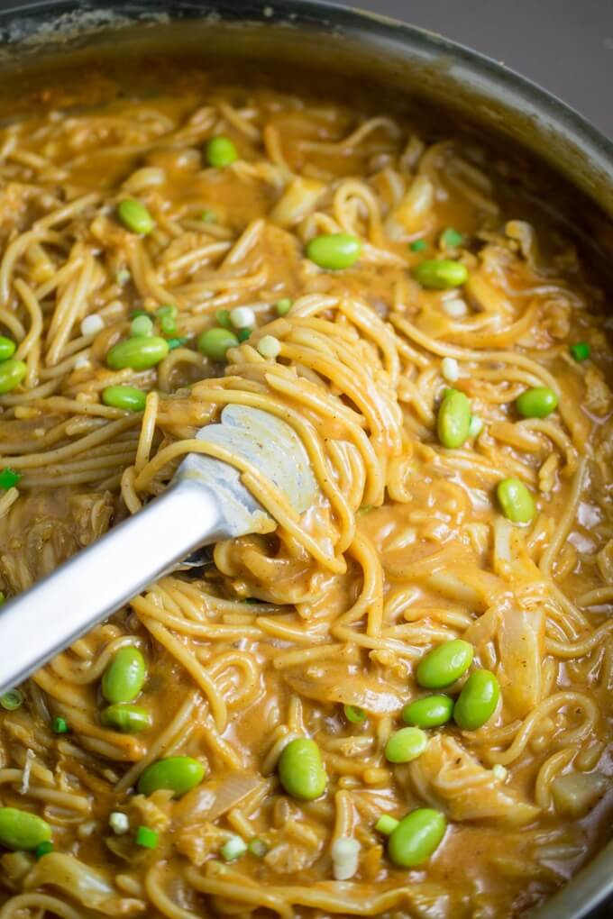 Spicy sriracha almond butter noodles with steamed edamame and scallions stirred in.