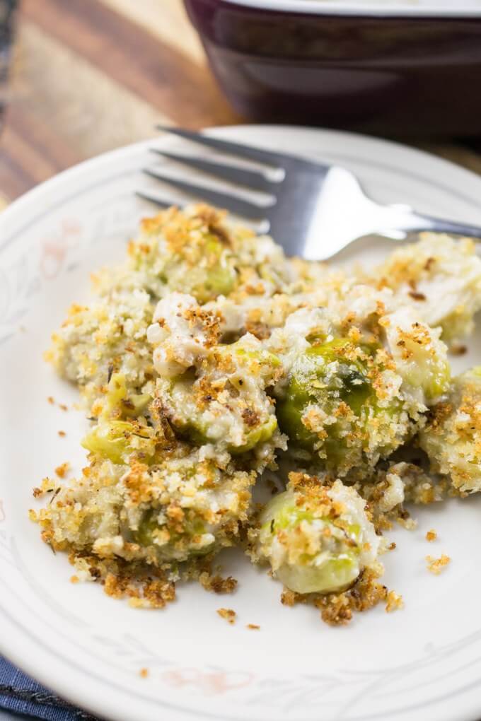 Close-up of roasted Brussels sprouts on a plate tossed with dairy-free cashew mozzarella and browned toasted breadcrumbs