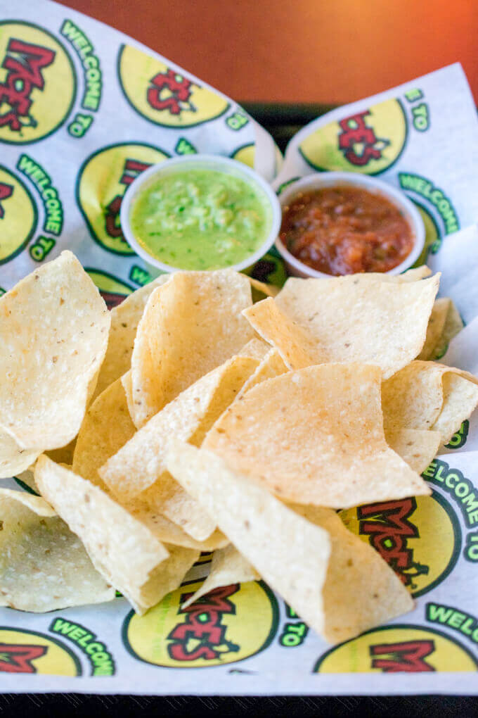 Chips and two kinds of salsa, green and red, from Moe's Southwest Grill
