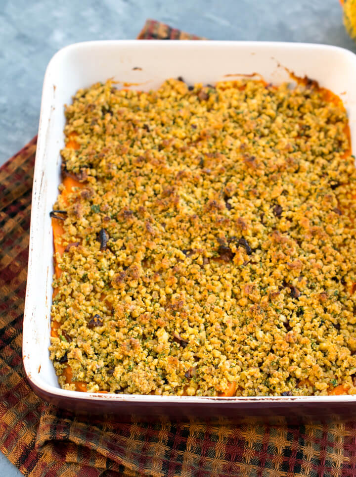 Savory vegan sweet potato casserole after being removed from the oven showing brown toasted walnuts on top